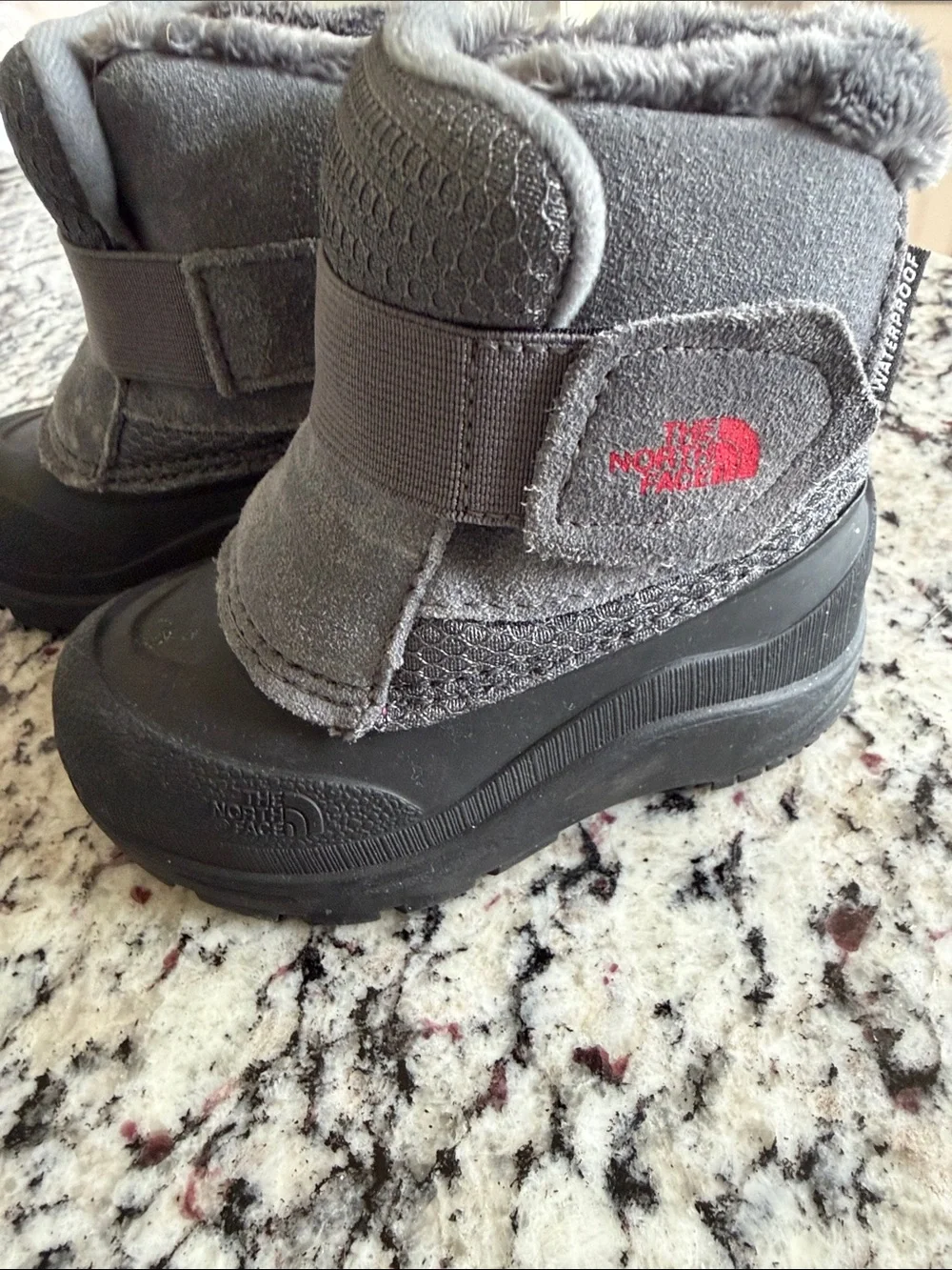 The North Face Kids Gray and Black Waterproof Snow Boots with Red Logo